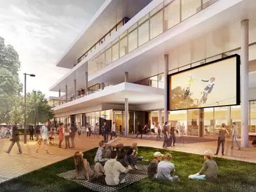 Modern building with people socializing outdoors in the evening.