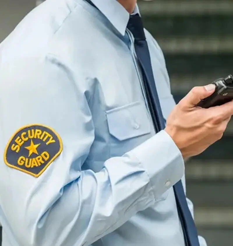 Security officer communicating with corporate security companies during an event.