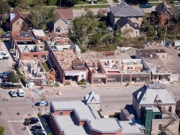 Aerial view of a neighborhood with residential houses and some under construction.