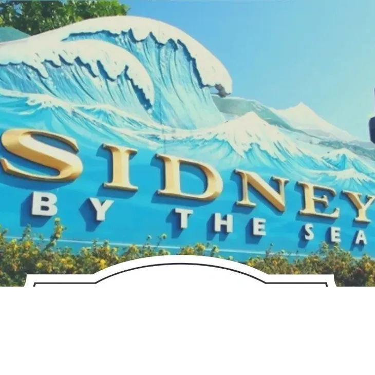 Sidney by the Sea sign with stylized waves