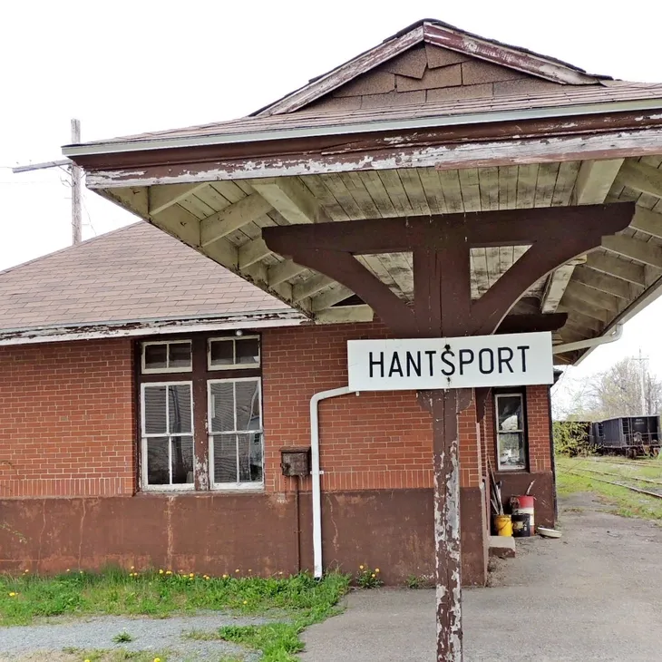 Historic Hantsport train station building with sign