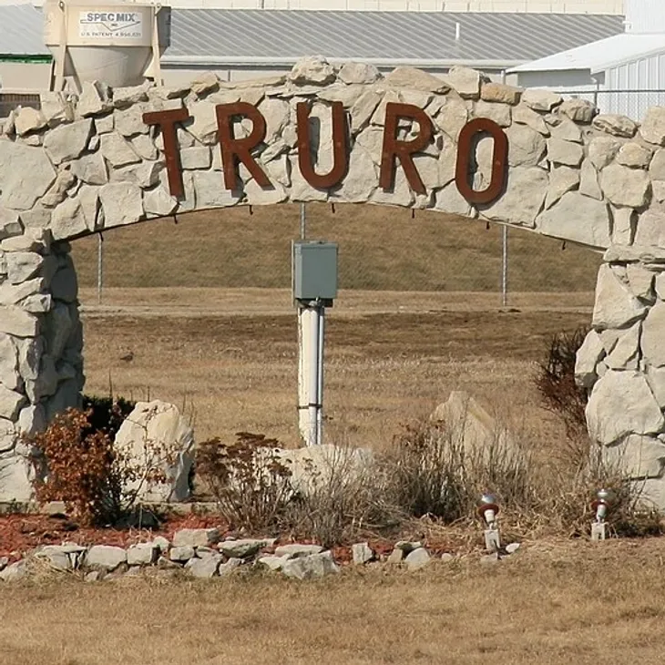 Stone arch entrance with TRURO sign