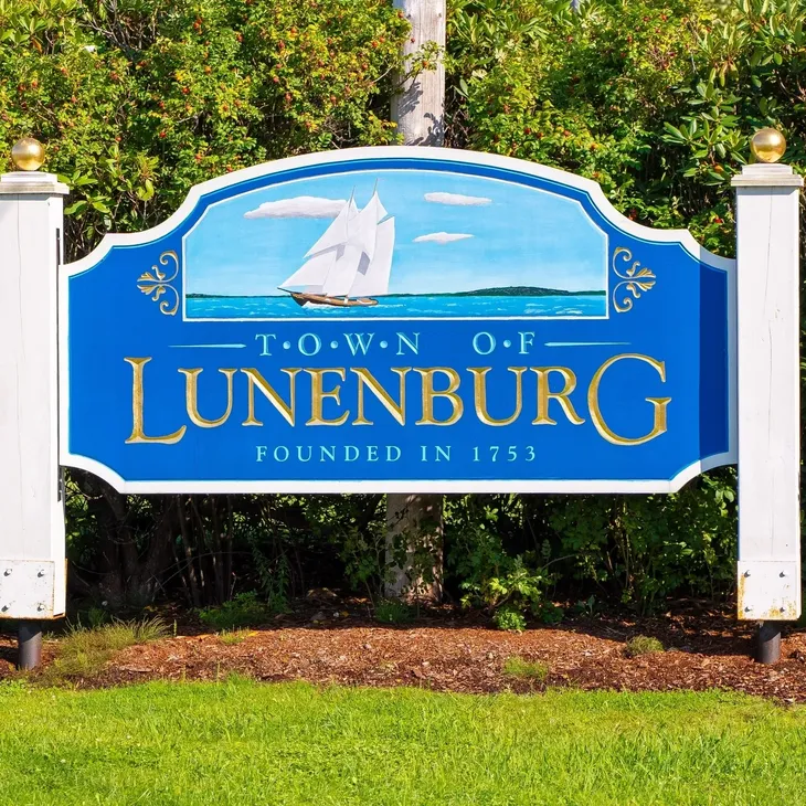 Blue Town of Lunenburg sign with sailboat
