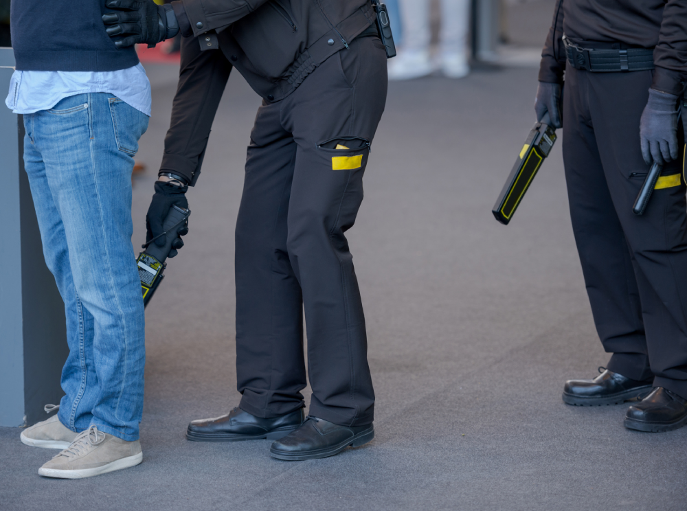 Corporate security inspects, an individual before an event.